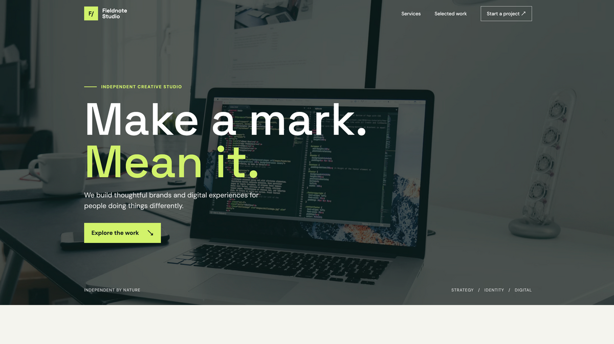 Fieldnote creative studio homepage with dark photographic hero, lime accents and the headline Make a mark. Mean it.