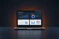 Google Ads Audit service by DD Network — laptop showing a Google Ads dashboard with campaign metrics and keyword analysis