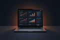Monthly SEO service by DD Network — laptop showing keyword rankings climbing and organic traffic growth charts trending upward